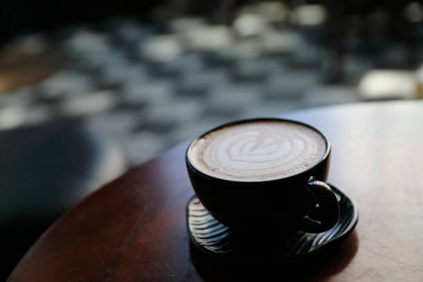 istock Cappuccino coffee break on wood background 928498206