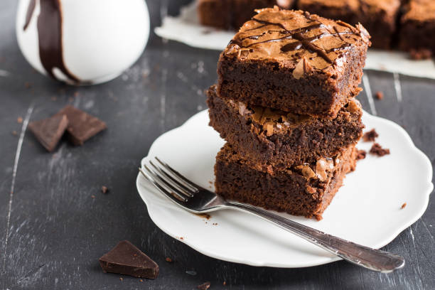 istock Chocolate brownie cake piece stack on plate homemade pastries 928511070