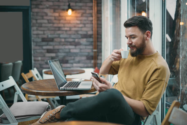 istock Young man sitting in cafe. 928516310