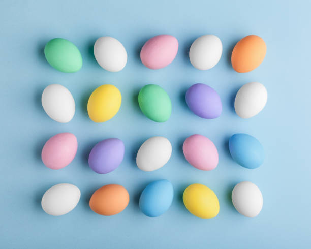 istock Creative Easter pattern made of colorful eggs painted in pastel colors. 928523268