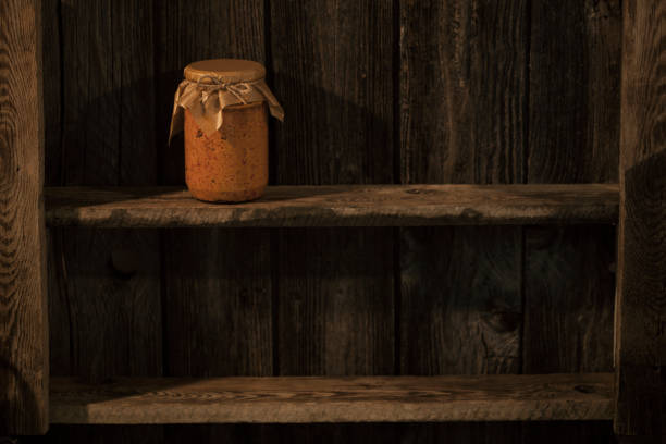 Storage shelves  with homemade  canned   vegetables   (Ajvar, delicious product of roasted red pepper.)