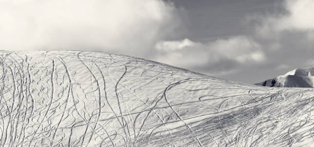 istock Panoramic view on slope for freeriding with traces from skis, snowboards 928524838