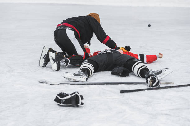 istock hockey player fell on the ice after a collision 928530530