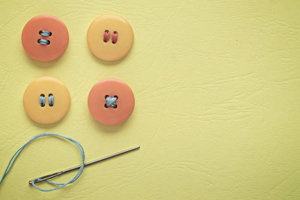 istock Pastel colors. Yellow and orange buttons 928530538