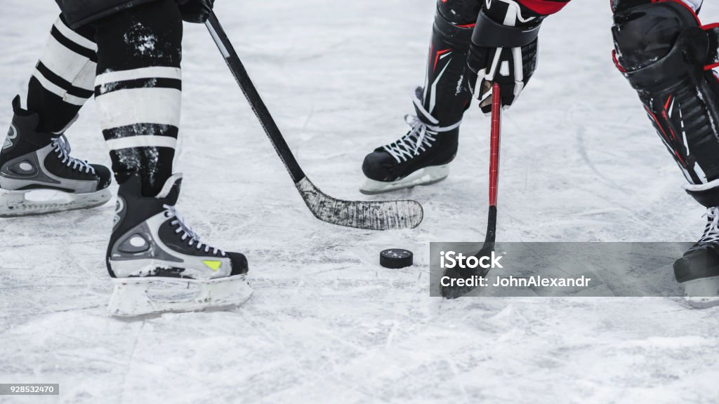 moment in the game when played washer close-up with the puck during the game Hockey Stock Photo