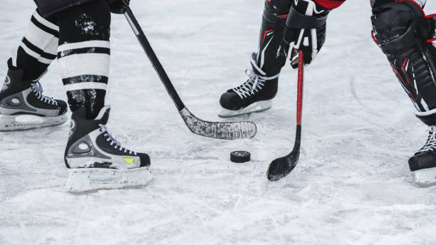 moment in the game when played washer close-up with the puck during the game hockey puck stock pictures, royalty-free photos & images