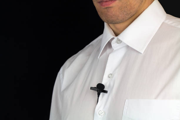 istock White man's shirt with lavalier microphone, preparation for interview 928532502