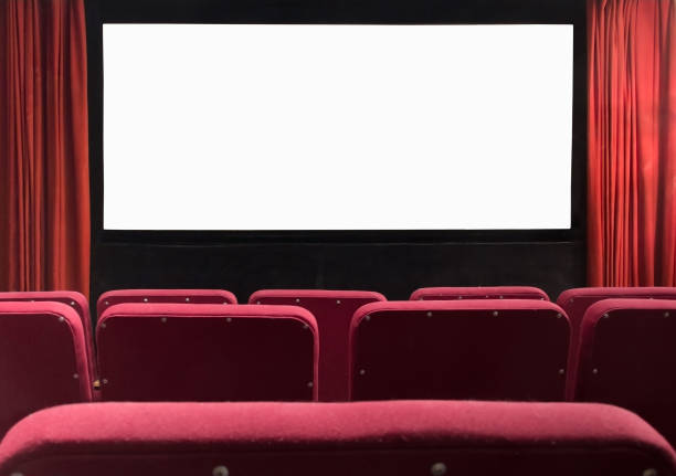 istock Movie cinema screen with empty seats and red curtains 928538200