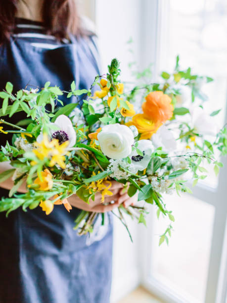 istock Beautiful floral composition and woman florist. Wedding decor. 928543122