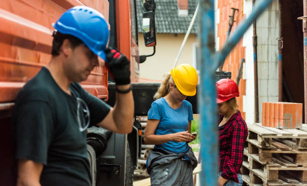 istock Female construction worker on phone 928545608