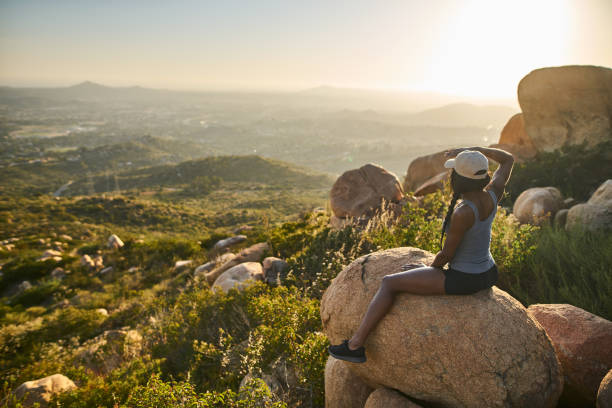 istock fit female african american hiker watching sunset 928549574
