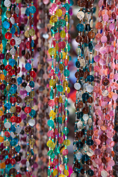 istock Many colorful necklaces hanging like a curtain 928549770