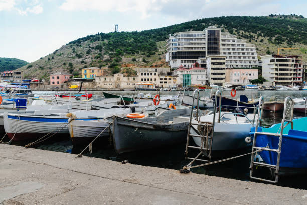 istock Fishing boats moored to a pier 928550422