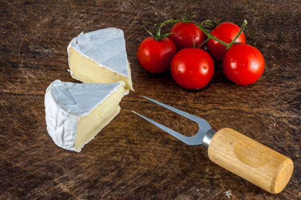 istock Closeup of brie cheese and cherry tomatoes 928553782