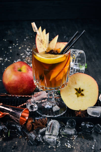 istock Cocktail Old Tom. Whiskey. On a black wooden background. 928557128