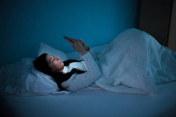 istock Woman surfing the Internet at night 928557200