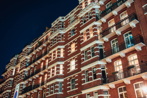 A classic apartment building in central London at night.