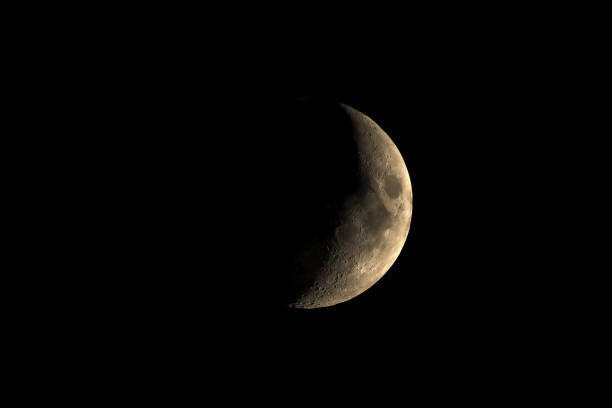 istock High contrast Waxing crescent moon seen with telescope 928562814