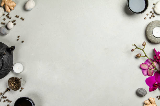 istock Asian tea set and spa stones on concrete background 928562868
