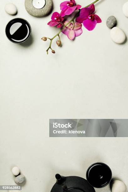 Asian Tea Set And Spa Stones On Concrete Background Stock Photo - Download Image Now