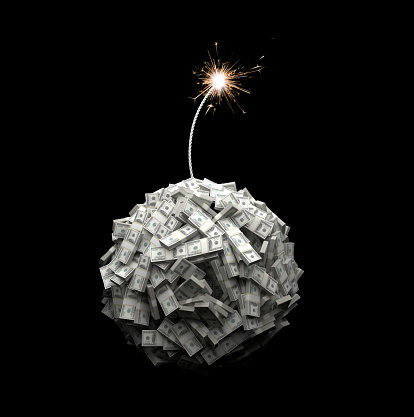Bundles of $100 US dollar notes form the shape of a spherical bomb. A lit fuse burns down towards the bomb.