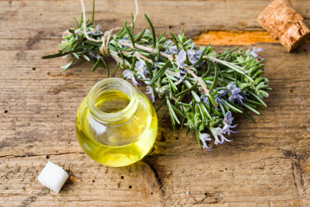 istock Rosemary oil with bouquet in blossom 928565812