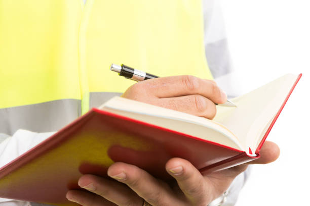 istock Engineer or architect hands holding agenda and writing plans 928568834