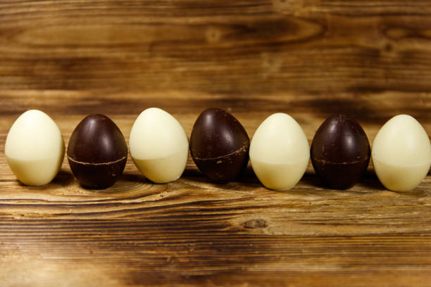 istock Small chocolate candies on wooden table 928569478