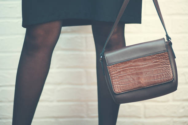 istock young woman hand bag 928576374