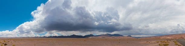 istock Atacama desert road, dark cloud, thunderstorm and rain 928577058