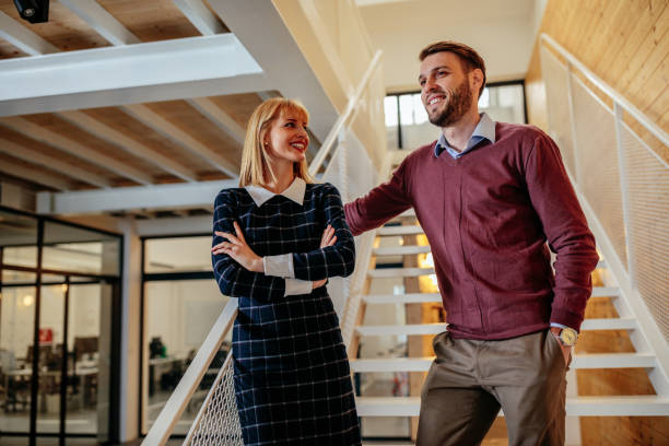 istock Shot of two colleagues standing in an office building 928580228