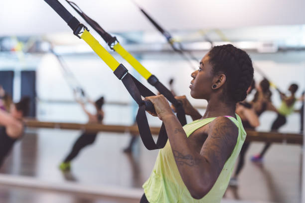 istock Group of Women Doing TRX Workout 928583156