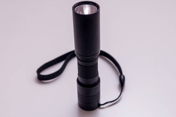 black torch with hand strap. led aluminium flashlight. - forensic science flash imagens e fotografias de stock
