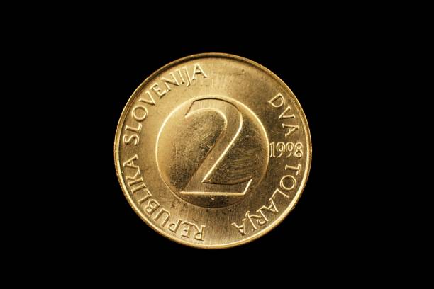 istock Slovenian Two Tolar Coin Isolated On Black 928594378