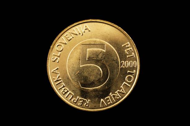 istock Slovenian Five Tolar Coin Isolated On Black 928594404