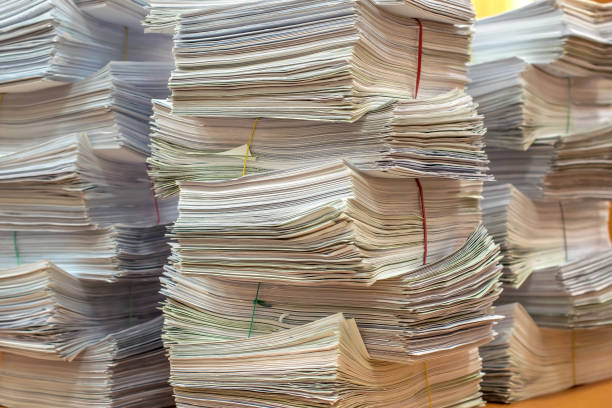 istock pile of paper documents in the office 928605524