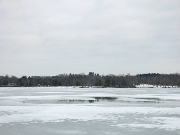 istock Danger Round Hole in thin Ice, Frozen Mohawk River 928608046