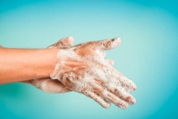 Washing hands Closeup of person washing hands isolated. Cleanliness and body care concept. pathogen photos stock pictures, royalty-free photos & images