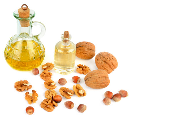 istock Oil of walnut and hazelnut, nut fruit isolated on white background. 928614196