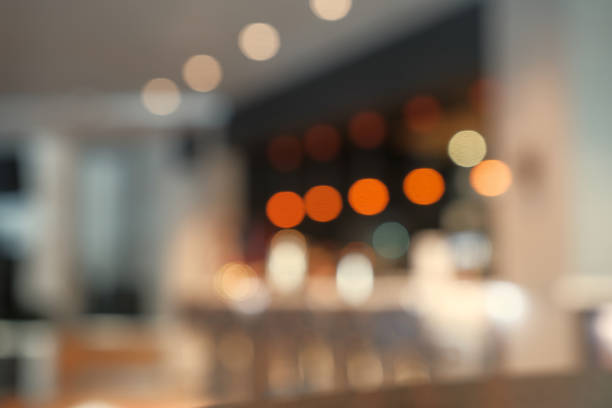 istock Blurry image of a cafe interrior background with bokeh 928618572