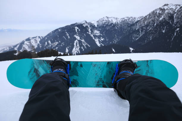 istock snowboarding legs on winter mountain  top 928626558