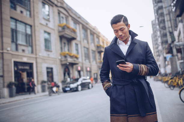 istock Man with mobile phone outdoors 928626628