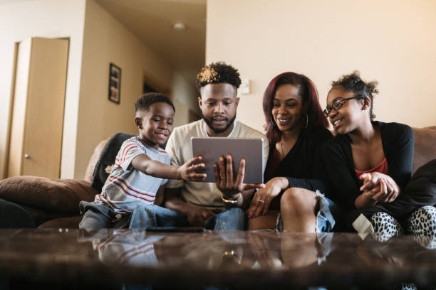 istock A Family Uses Digital Tablet Together at Home 928626936