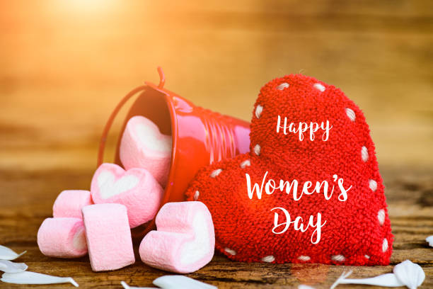 8 march happy women's day message on wooden background with handmade red heart and marshmallow in a red bucket. - cushion pillow heart shape multi colored imagens e fotografias de stock