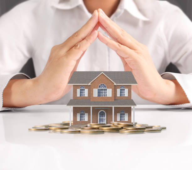 istock holding house representing home ownership 928630816