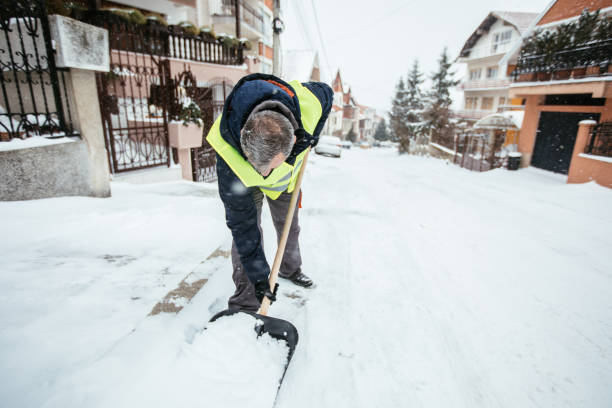 istock Senior man removing snow from doorway 928633172
