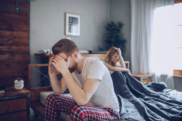 Couple having problems in bed Couple having arguments and sexual problems in bed human sexual behavior stock pictures, royalty-free photos & images