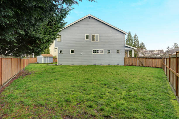 istock Fully fenced back yard with lots of space and a shed. 928636088