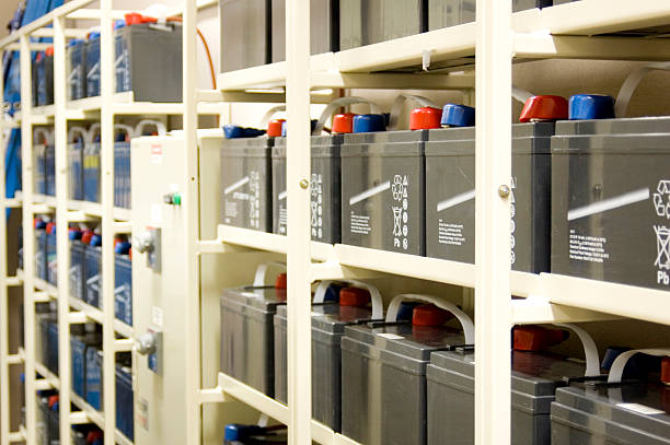 UPS batteries on rows of shelves stock photo