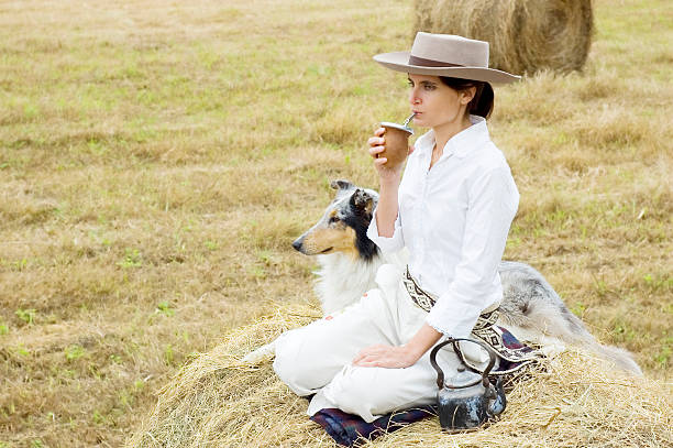 Farm Girl Drinking Mate stock photo